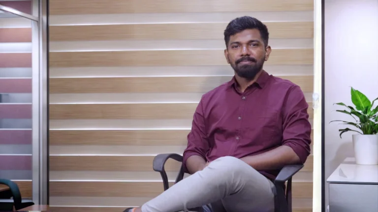 Julian Daniel Varghese, a digital marketing expert in Kochi, sitting in an office, passionate about helping brands grow through digital strategies.